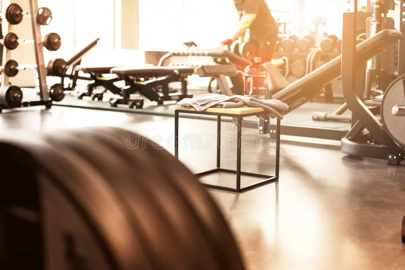 abstract-blur-fitness-gym-background-sunny-day-90863621